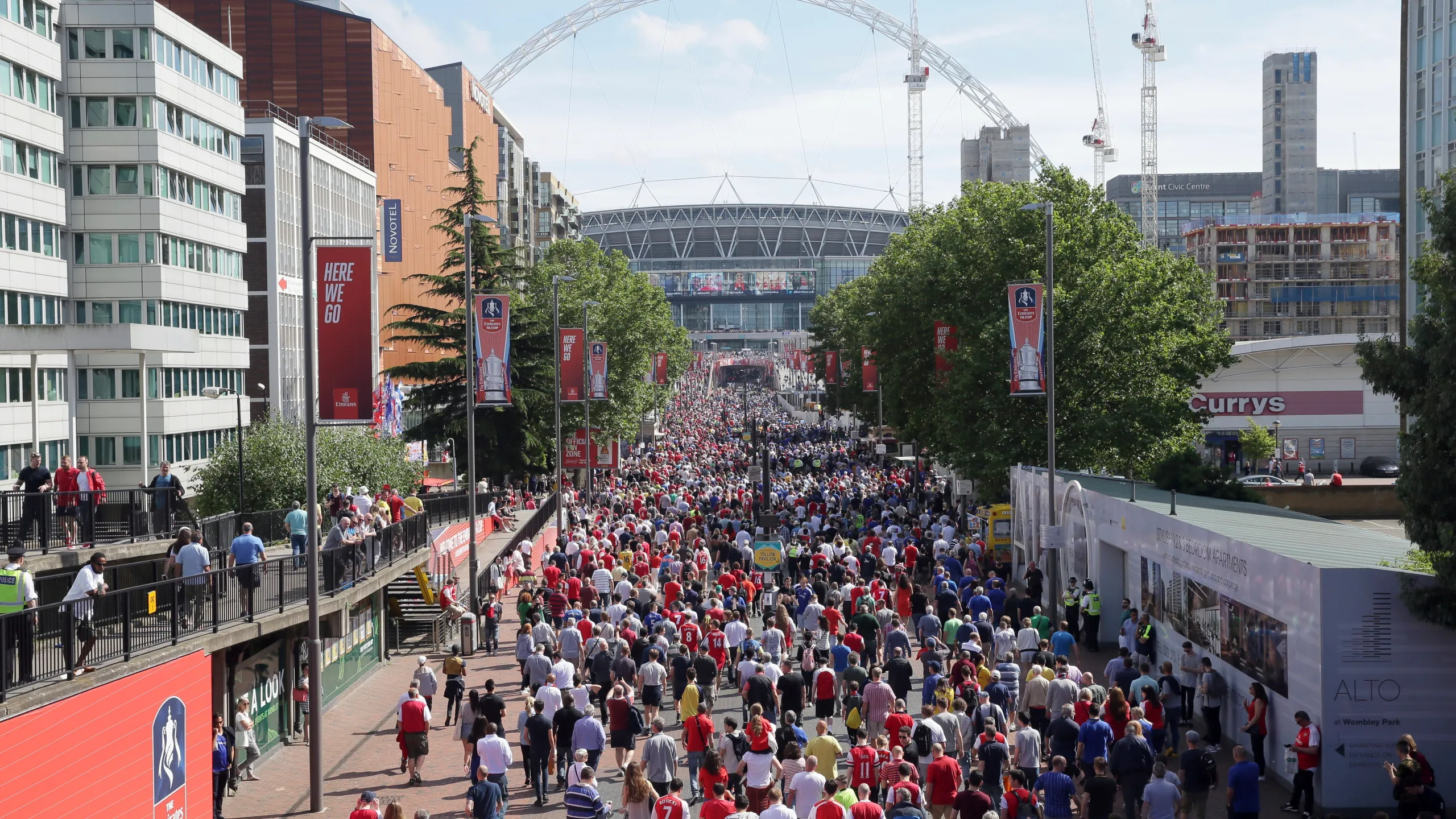 people going into a sports stadium